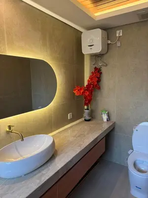 a bathroom with a sink and a toilet at LoftStyle Villa with nice Private Plunge Pool in Kerobokan