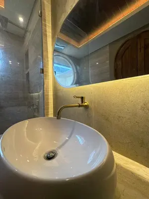 a white sink in a bathroom with a window at LoftStyle Villa with nice Private Plunge Pool in Kerobokan
