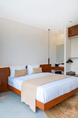 a bedroom with a large bed and a desk at Villa Aito, Luxury 3 BD Private Villa near Beach - Bali in Seminyak