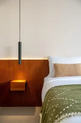 a bedroom with a bed with a nightstand and a bed sidx sidx at Villa Aito, Luxury 3 BD Private Villa near Beach - Bali in Seminyak