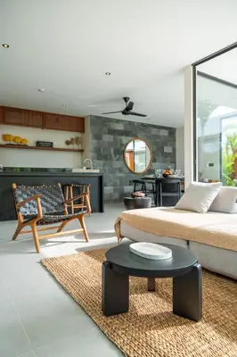 a living room with a bed and a table at Villa Aito, Luxury 3 BD Private Villa near Beach - Bali in Seminyak