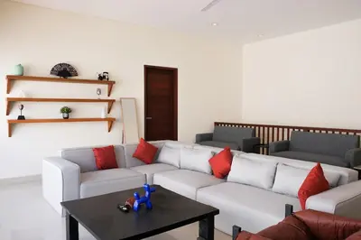 a living room with a couch and a table at 5beds, 10 ppl, 10mins to beach, Private Pool in Sanur