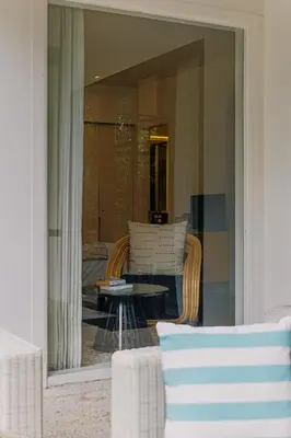 a view of a living room with a table and chairs at Luxury with A Soul - Martini 2 1BR Villa Reimagined in Kerobokan