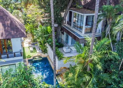 an overhead view of a building with a swimming pool and palm trees at Walk into Serenity, Martini 3 - 1BR Treetop Villa in Kerobokan