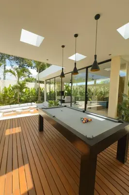 a pool table in the middle of a house at Villa Kina - Tropical 2BR Villa with Pool and Billiard in Seminyak