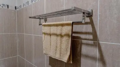 a towel rack in a bathroom with a towel at 2 Bedroom Villa with Private Pool & Kitchen in Jimbaran