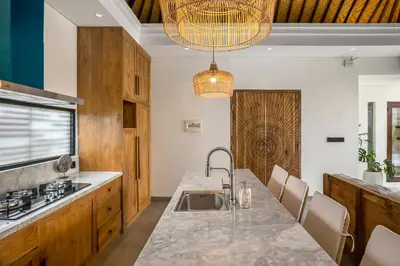 a kitchen with a sink and a counter top at Priviere Seminyak - 2BR Villa with Pool Near Beach in Seminyak