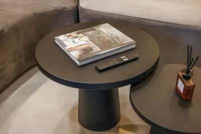a table with a book and a remote control on it at Luxury Couple 2 BR Villa Umalas, Rooftop, Pool & View in Kerobokan