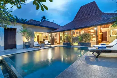 a swimming pool in the backyard of a house at Joglo-Style 3 Bedroom Villa in Heart Of Seminyak in Seminyak