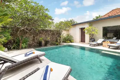 an image of a swimming pool in a backyard at Joglo-Style 3 Bedroom Villa in Heart Of Seminyak in Seminyak