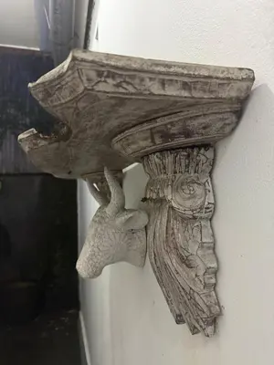a wooden object is attached to a wall at Gypsy Boutique Villa in Seminyak