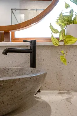 a sink in a bathroom with a window at Green Mutiara Jimbaran in Jimbaran