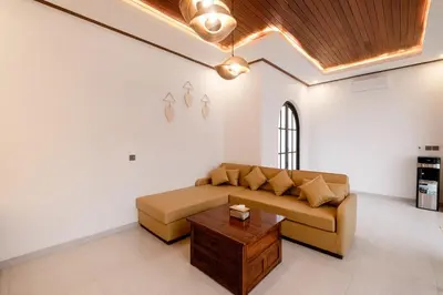 a living room with a couch and a coffee table at Green Mutiara Jimbaran in Jimbaran