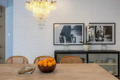 a dining room table with a bowl of oranges on it at Villa Arta - A Calm, Tropical Villa in Umalas in Canggu