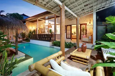 a swimming pool in the backyard of a villa at Seminyak Beach Seagrass Villa 4BR - pool & staff in Seminyak