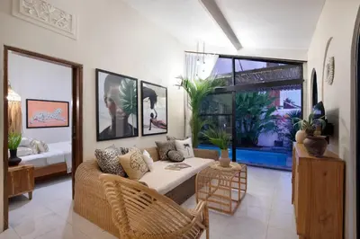 a living room with a couch and a table at Villa Sobramesa Seminyak with pool, butler & parking in Seminyak