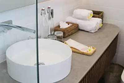 a bathroom with a sink and a bath tub at Rowena Comfortable 2 BR Private Pool Villa in Canggu