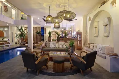 a living room with a couch and a pool at 5 min walk to Seminyak Beach - Architect Designed Luxury Villa - Private Butler & Breakfast in Seminyak