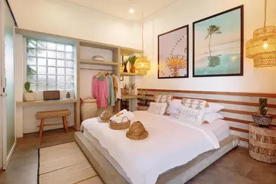 a bedroom with a large bed with two baskets on it at 5 min walk to Seminyak Beach - Architect Designed Luxury Villa - Private Butler & Breakfast in Seminyak