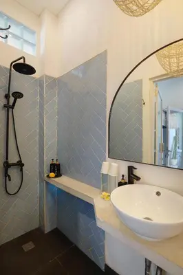 a bathroom with a sink and a mirror at 5 min walk to Seminyak Beach - Architect Designed Luxury Villa - Private Butler & Breakfast in Seminyak