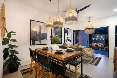 a dining room with a table and chairs at 1BR Villa Private Pool Seminyak Mertanadi in Seminyak