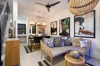 a living room with a couch and a table at 1BR Villa Private Pool Seminyak Mertanadi in Seminyak