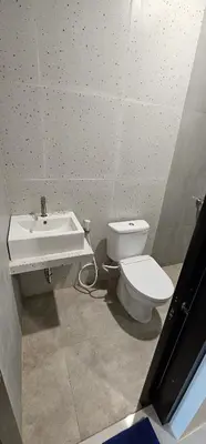 a bathroom with a toilet and a sink at Jepun segara homestay in Ngurah Rai International Airport