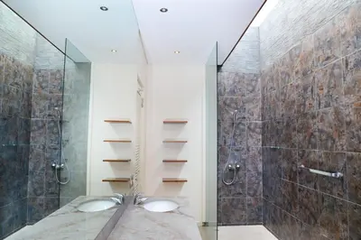a bathroom with two sinks and a shower at Villa Tentrem Legian in Legian