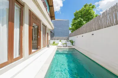 a swimming pool in the backyard of a house at 1BR Japanese Inspired Bali Villa in Kerobokan in Kerobokan