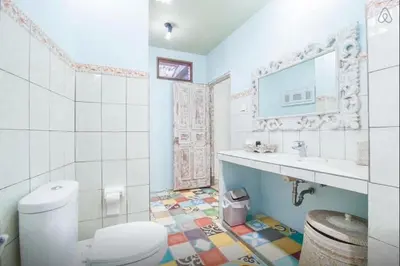 a bathroom with a toilet and a sink at 2 BR Central Seminyak Villa Hibiscus Walk to shop and Beach in Seminyak