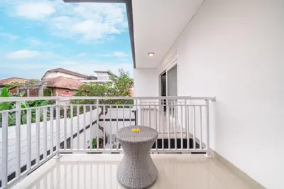a white balcony with a vase sitting on it at Q LE Villa 2 is 2BR Villa with Private Pool in Seminyak in Seminyak