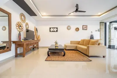 a living room with a couch and a table at Q LE Villa 2 is 2BR Villa with Private Pool in Seminyak in Seminyak