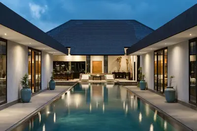 a swimming pool in the middle of a house at Villa Kalooka by BaliSuperHost in Seminyak