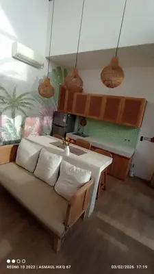 a living room with a couch and a table at Palm Harmony Villa's Seminyak in Seminyak