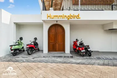 two motorcycles parked in front of a building at Hummingbird Villa by Bukit Vista in Kerobokan