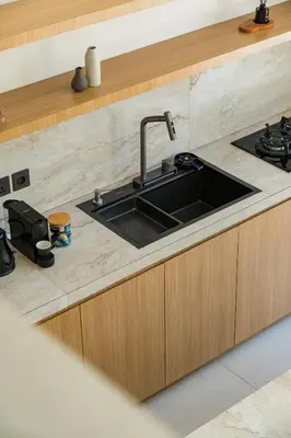 a kitchen with a sink and a stove at Private Romantic Pool 1bd Villa in Seminyak in Seminyak