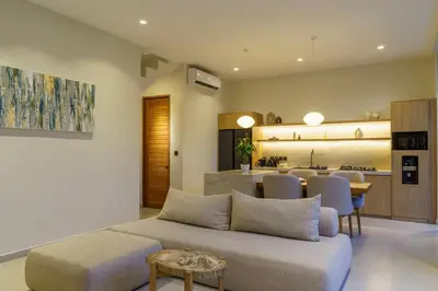 a living room with a couch and a table at Private Romantic Pool 1bd Villa in Seminyak in Seminyak