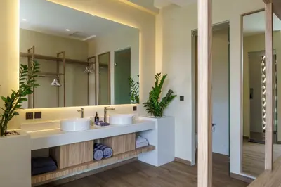a bathroom with two sinks and a large mirror at Private Romantic Pool 1bd Villa in Seminyak in Seminyak