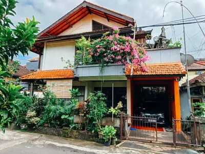 a house with flowers on the side of it at Widi House in Nusa Dua