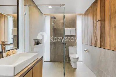 a bathroom with a sink and a toilet and a shower at Niskala Villa by Kozystay - Natadesa Resort in Jimbaran