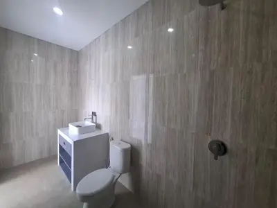 a bathroom with a toilet and a sink at Villa umalas in Seminyak