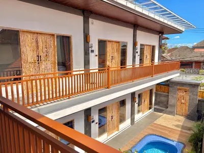 an image of a balcony of a house with a swimming pool at Tanhana Seminyak in Kerobokan