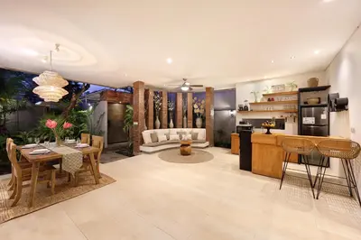a living room with a kitchen and a dining room at 6BR Seminyak Oasis with 2 Private Pools in Seminyak