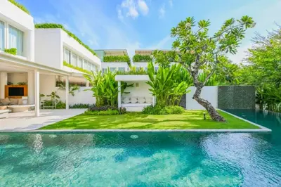 an exterior view of a villa with a swimming pool at Yahira Stunning Garden 5 BR Private Pool Villa in Canggu