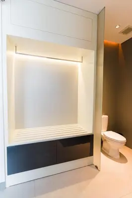 a bathroom with a toilet in a room at 3 Bedroom Seminyak Apartment -3 in Seminyak