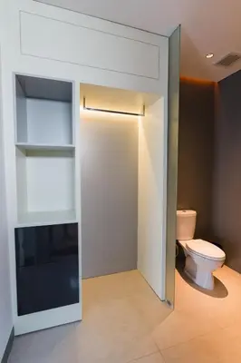 a bathroom with a toilet and a sink at 3 Bedroom Seminyak Apartment -3 in Seminyak