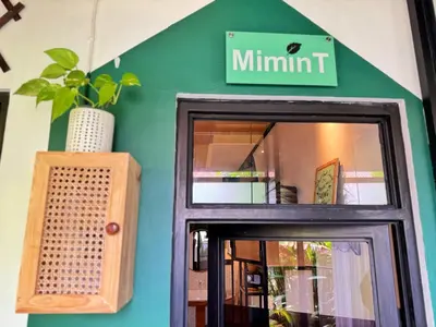 a sign above a door of a restaurant at Private Room, 2 Minutes walk to KuDeTa Beach Seminyak in Seminyak
