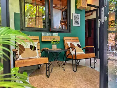 a room with two chairs and a table at Private Room, 2 Minutes walk to KuDeTa Beach Seminyak in Seminyak