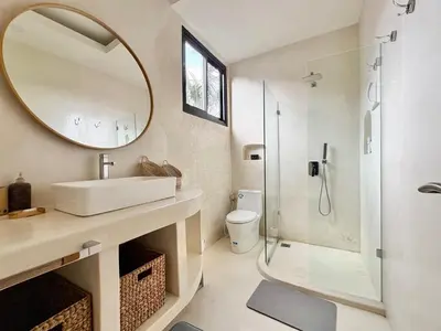 a bathroom with a sink and a mirror at Casa Bali in Kerobokan