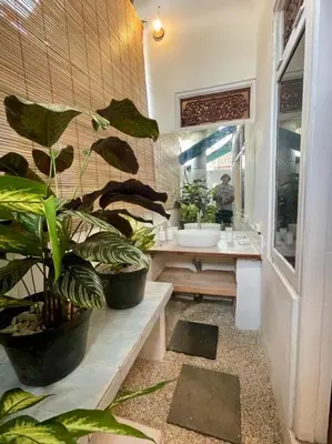 a bathroom with potted plants and a sink at Digital Nomad Oasis in Bali Calm, Cozy, Connected in Kerobokan